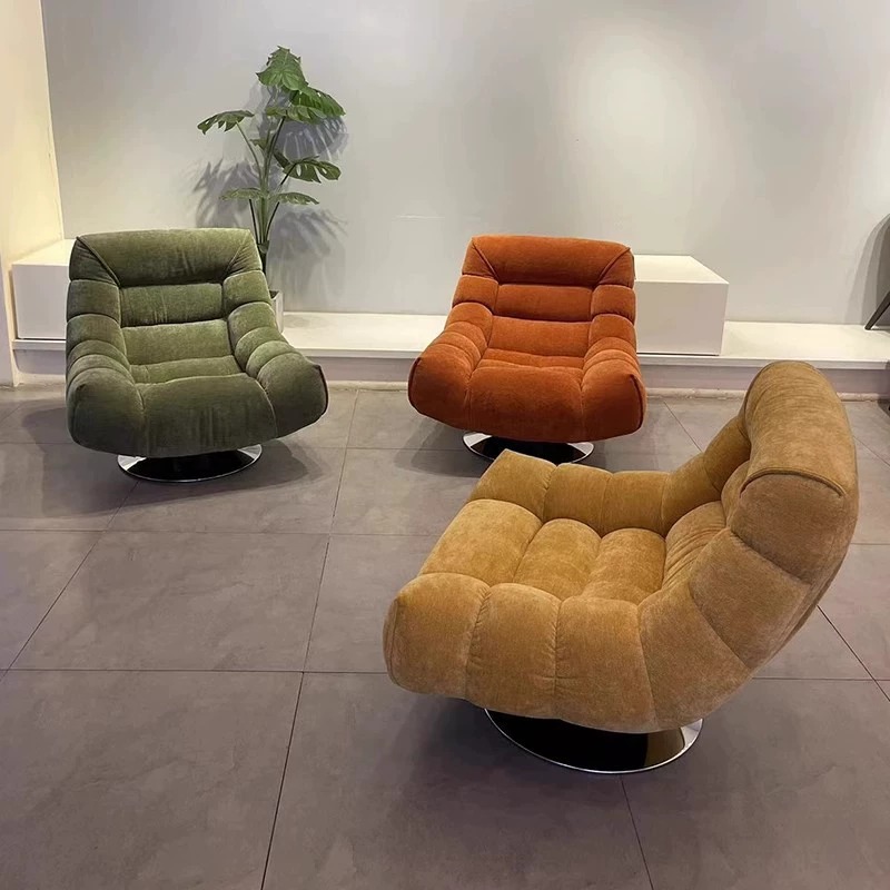 Chenille swivel lounge chair with 360 rotating metal base in modern living room