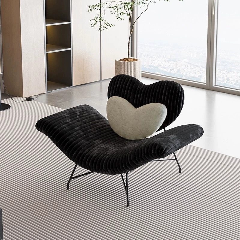 Elegant heart-shaped plush velvet leisure lounge chair in luxury living room