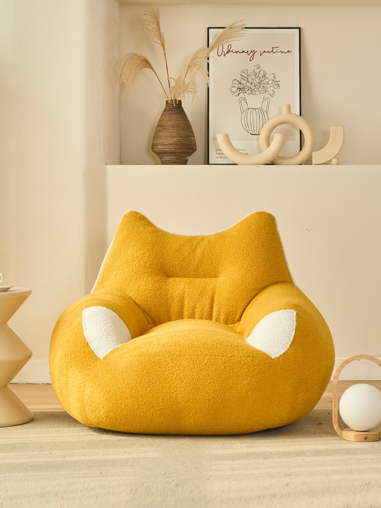 Cream-colored lounge chair — minimalist small sofa lounge chair