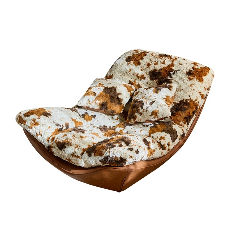 Cow print accent rocking chair for cozy home reading corner