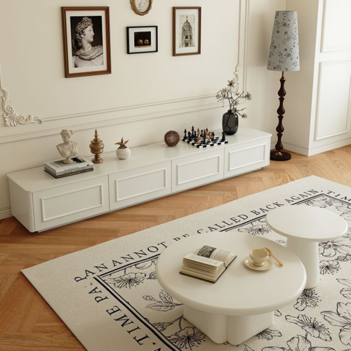White modern coffee table with round design.