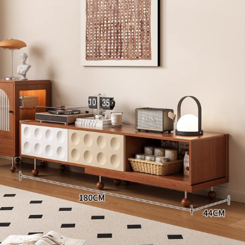 Wooden media console with circular panels and storage compartments.