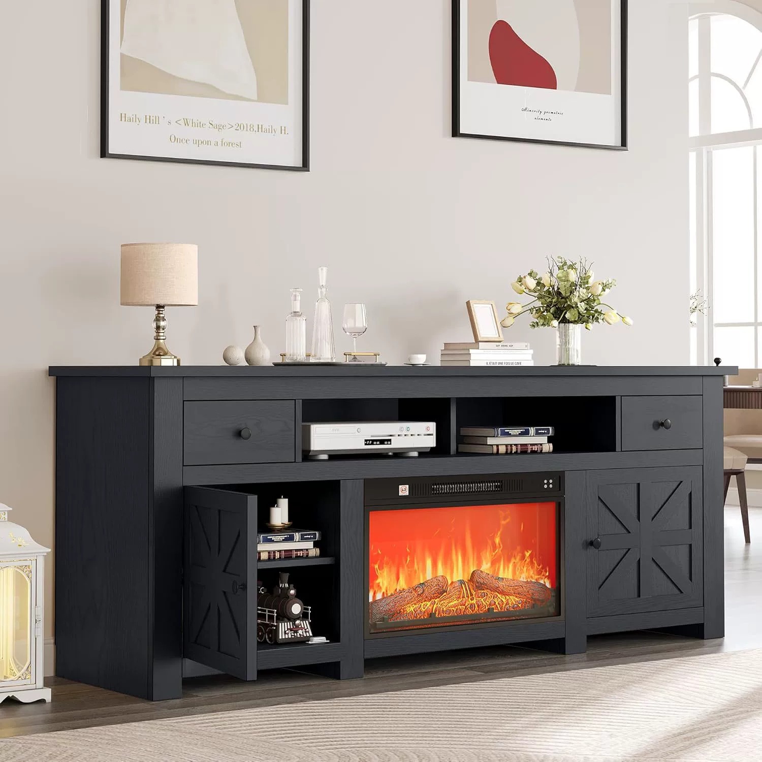 Black electric fireplace TV console with storage drawers.