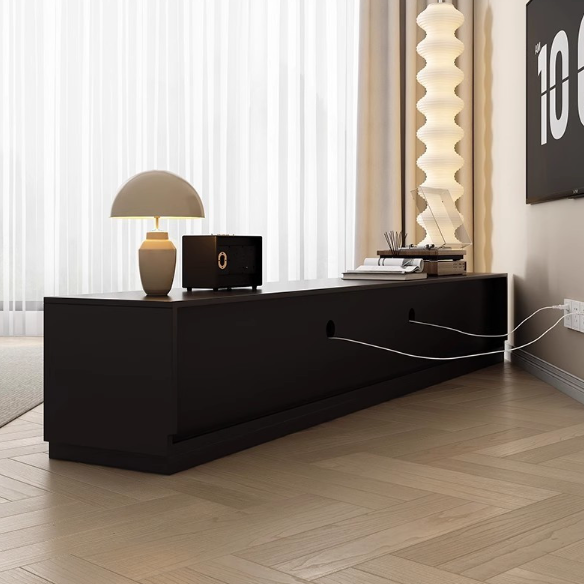 Modern black TV console with minimalist design and ambient lighting.