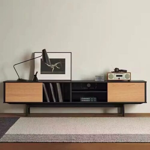 Modern wooden TV console with black accents and minimalist decor.