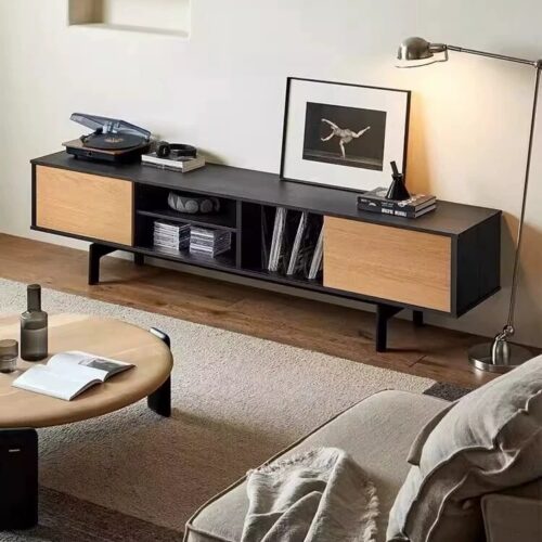 Modern black and wood media console with open shelving.