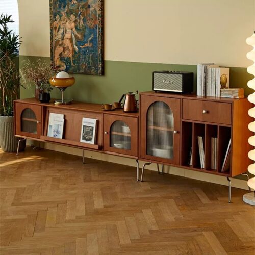 Wooden media console with glass doors and metal legs.