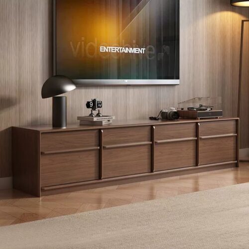 Modern wooden media console with drawers under TV.