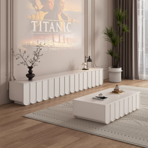 White modern TV console with matching coffee table.