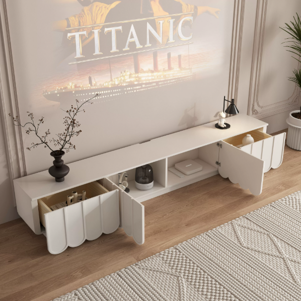 Modern white media console with open drawers and scalloped doors.