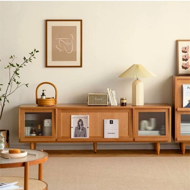 Wooden sideboard with glass doors and decorative items.