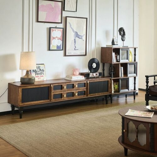 Wooden sideboard with black panels and brass handles.