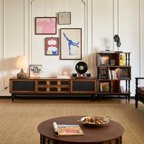 Mid-century modern wooden TV console with bookshelf and record player.