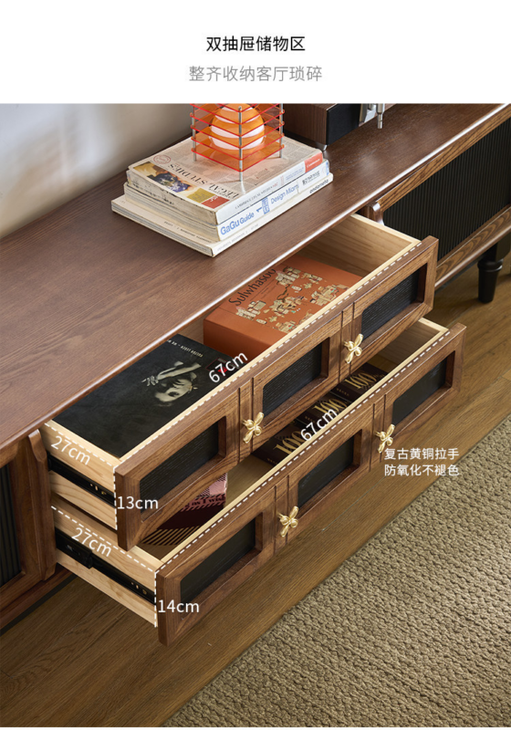 Wooden TV stand with double drawers and brass handles.