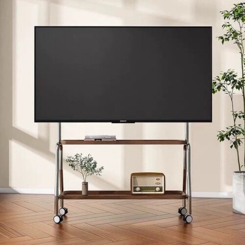 TV stand with wheels holds TV and decor on two shelves.