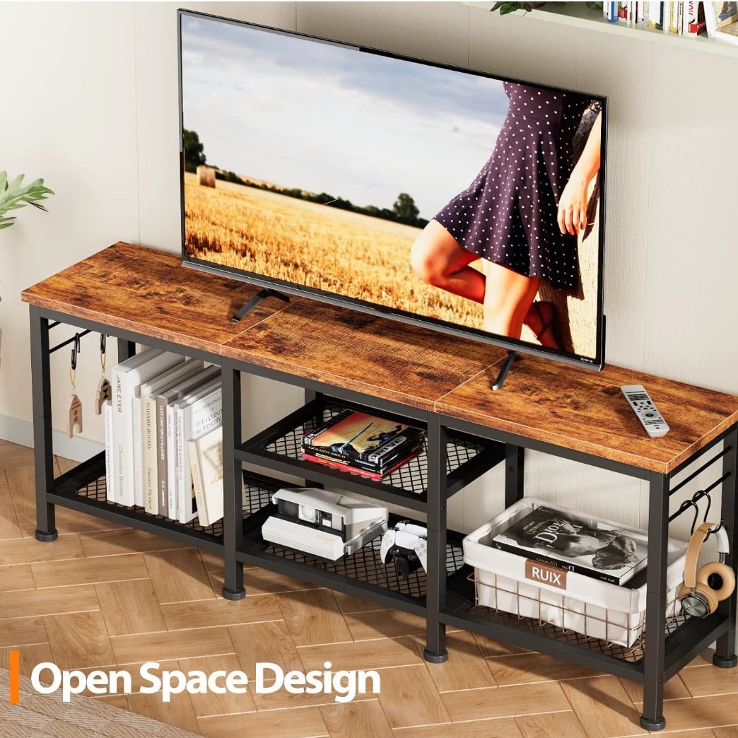 Industrial style TV stand with open shelves and wooden top.