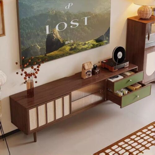 Modern wooden console with green drawers and glass panel.
