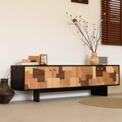 Modern wooden sideboard with geometric patterns and brass knobs.