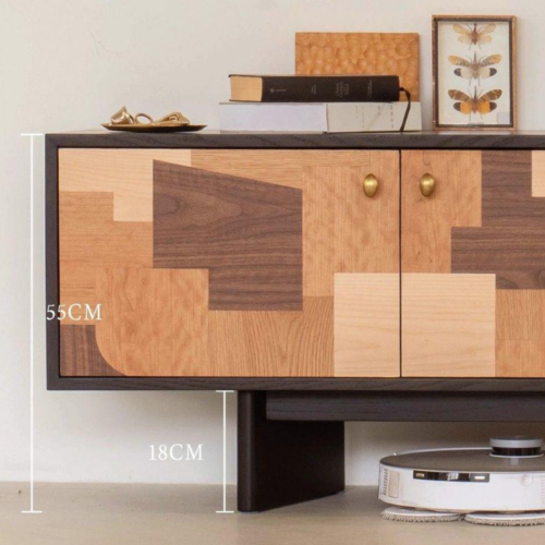 Modern wooden sideboard with geometric panel design and brass knobs.