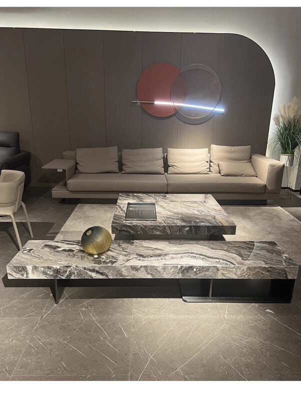 Modern gray sofa with marble coffee tables in minimalist living room.