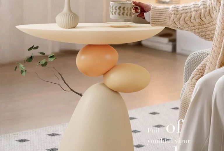 Balancing pebble art decor side table in cream resin from QONKA HOME